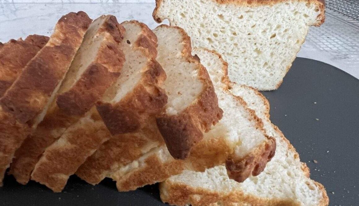 loaf of freshly baked gluten-free bread cut into slices